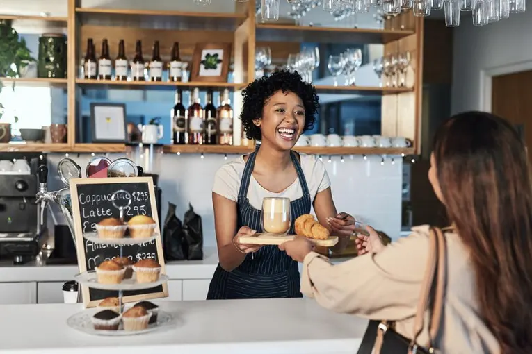 Local café owner serving customers